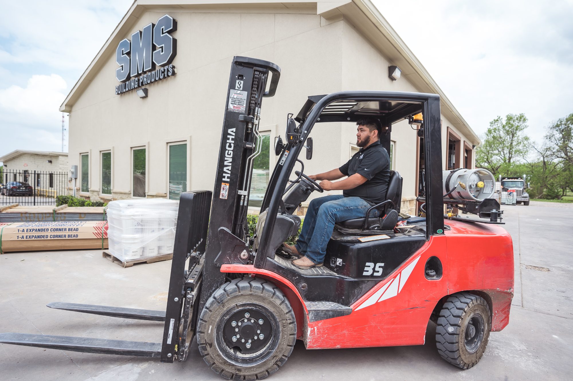 Yard operator moving material on a forklift